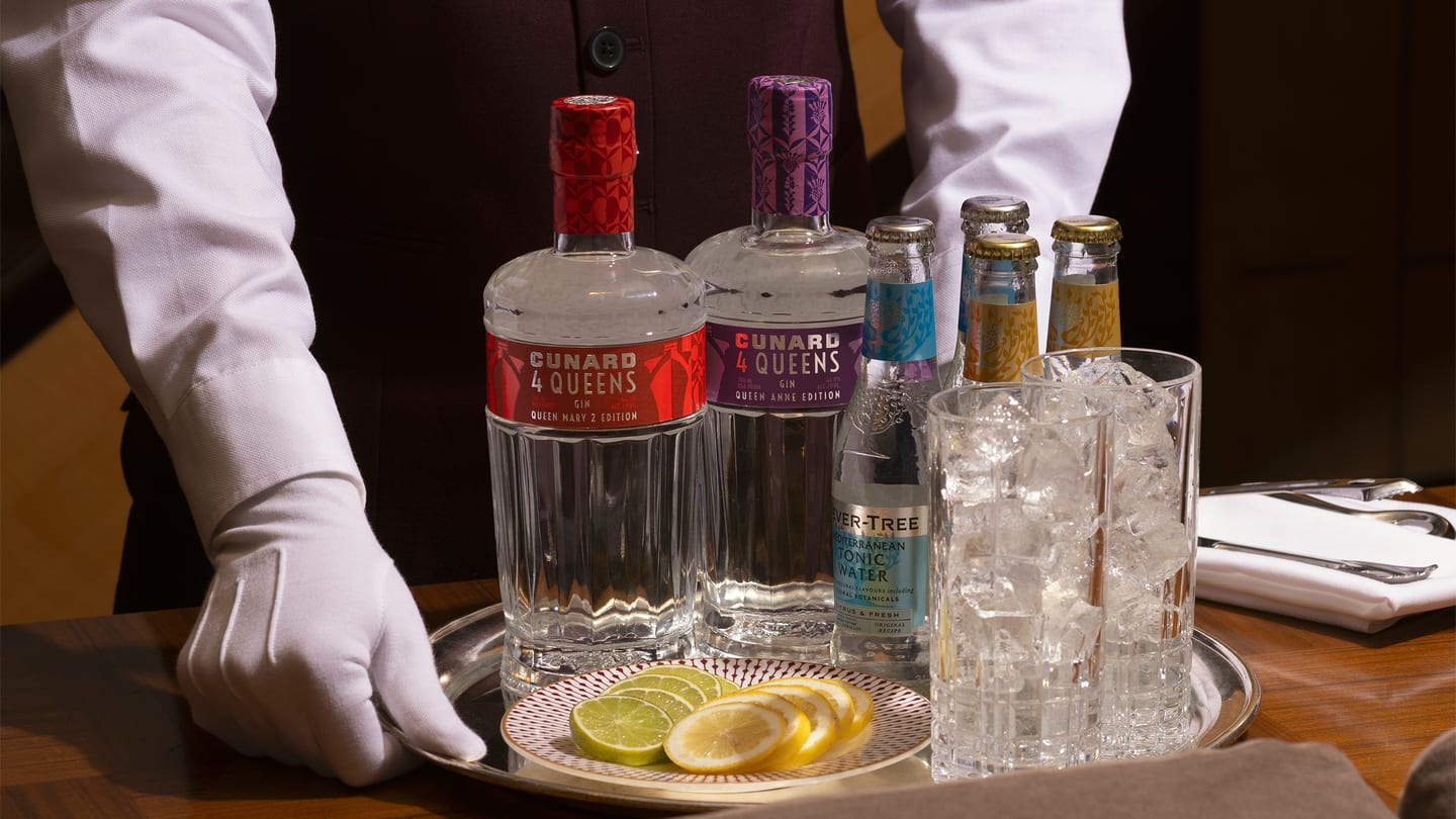White glove tray service carrying the Queen Mary 2 and Queen Anne editions
