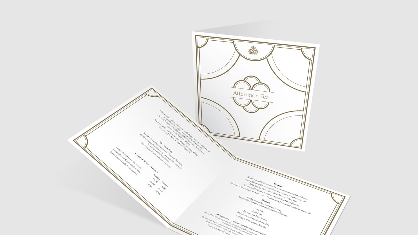 Afternoon Tea menu shown closed and opened to the savoury, scone and sweet listings