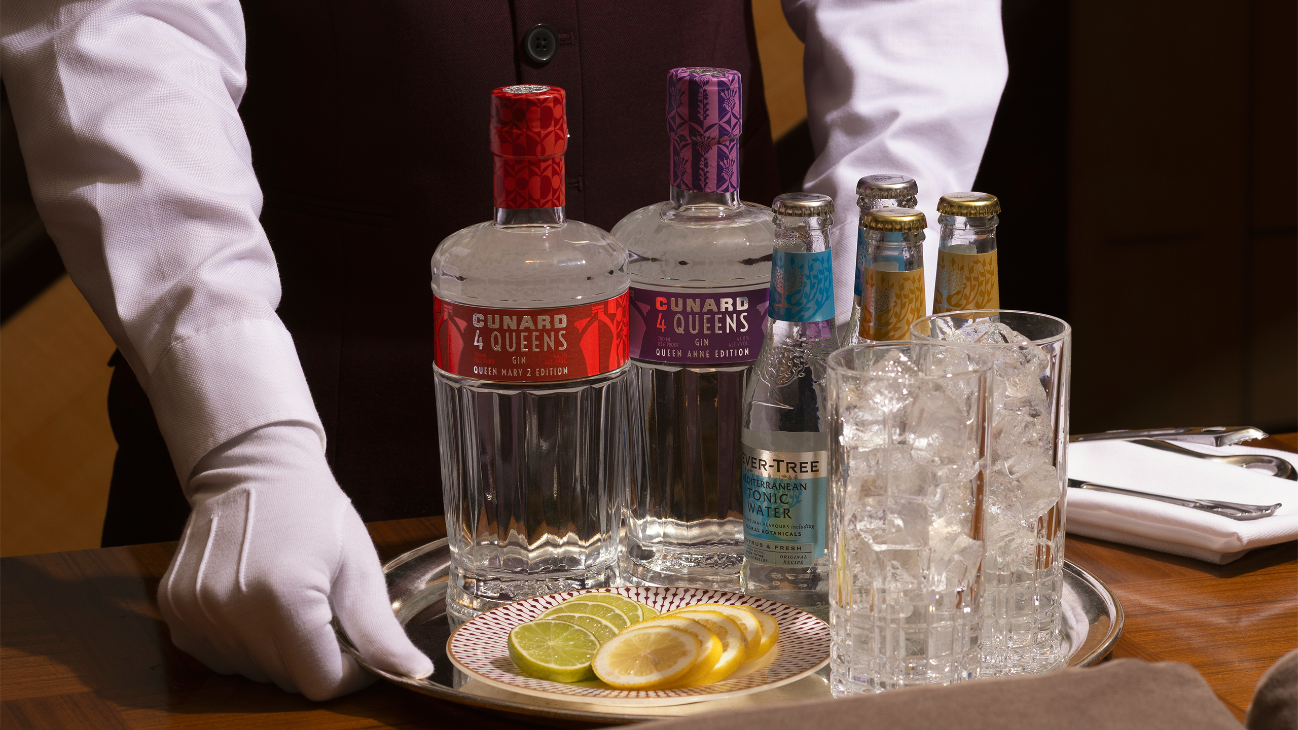 White glove tray service carrying the Queen Mary 2 and Queen Anne editions