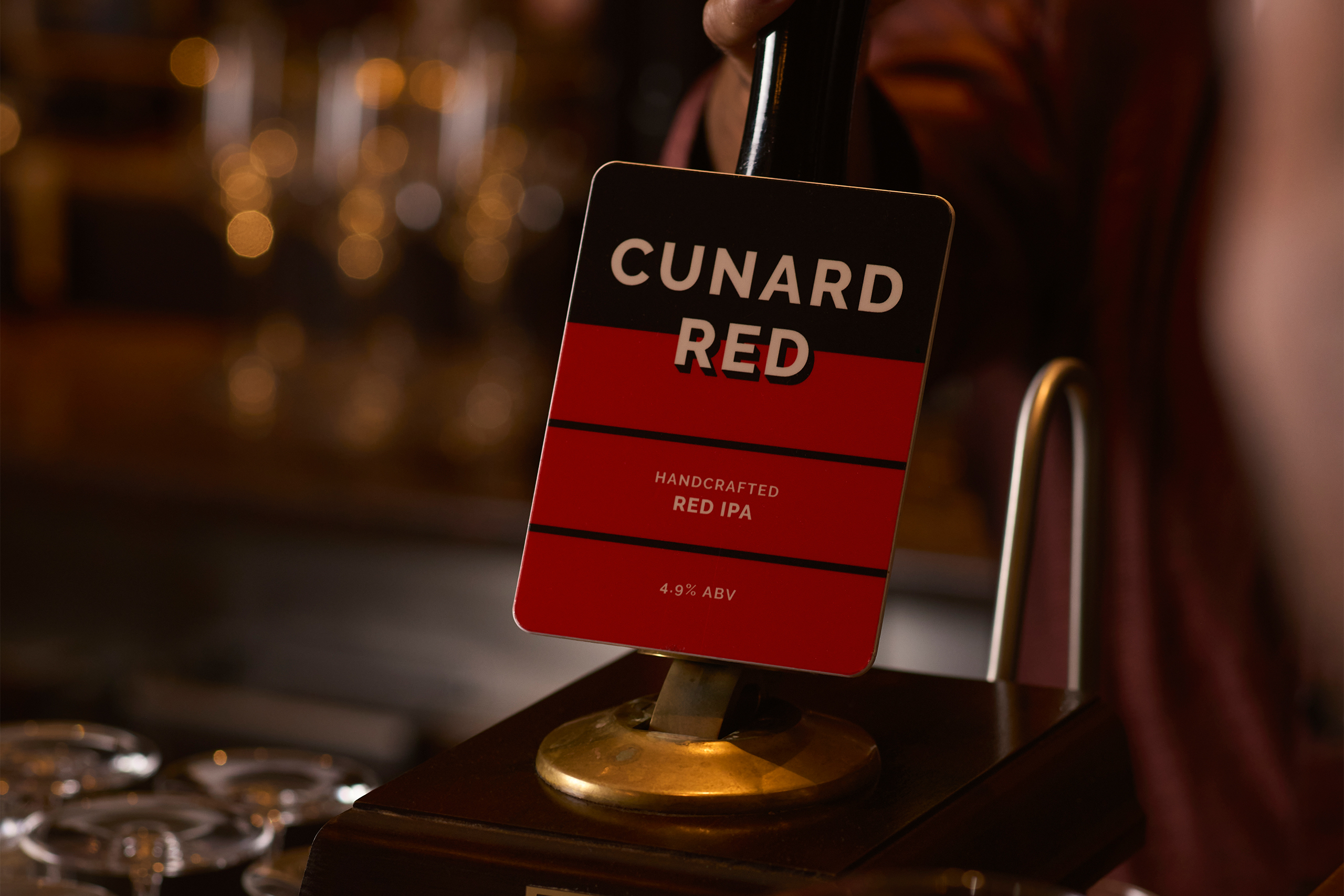 Cunard Red cask pump clip on the bar as a pint is pulled